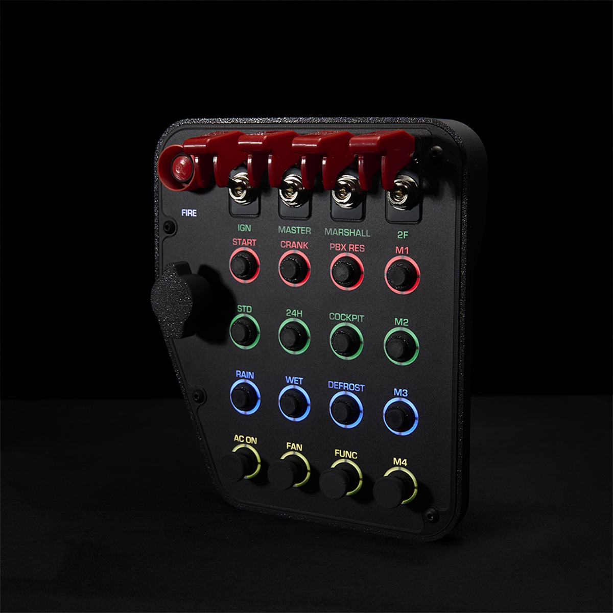 A black automotive dashboard control panel with red, green, blue, and yellow switches and knobs, photographed against a solid black background.